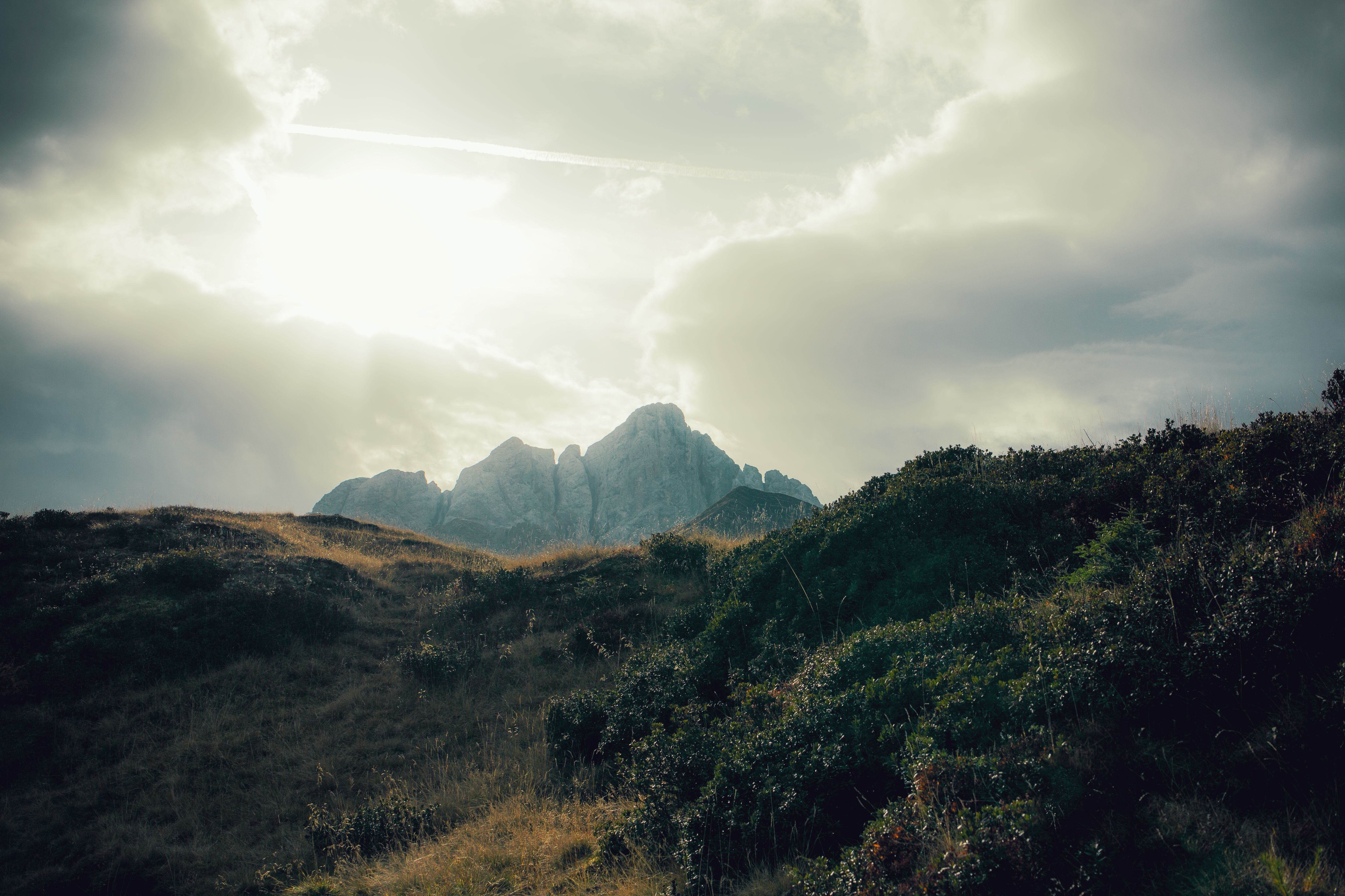 Majestic Mountain Peaks Under Cloudy Sky · Free Stock Photo