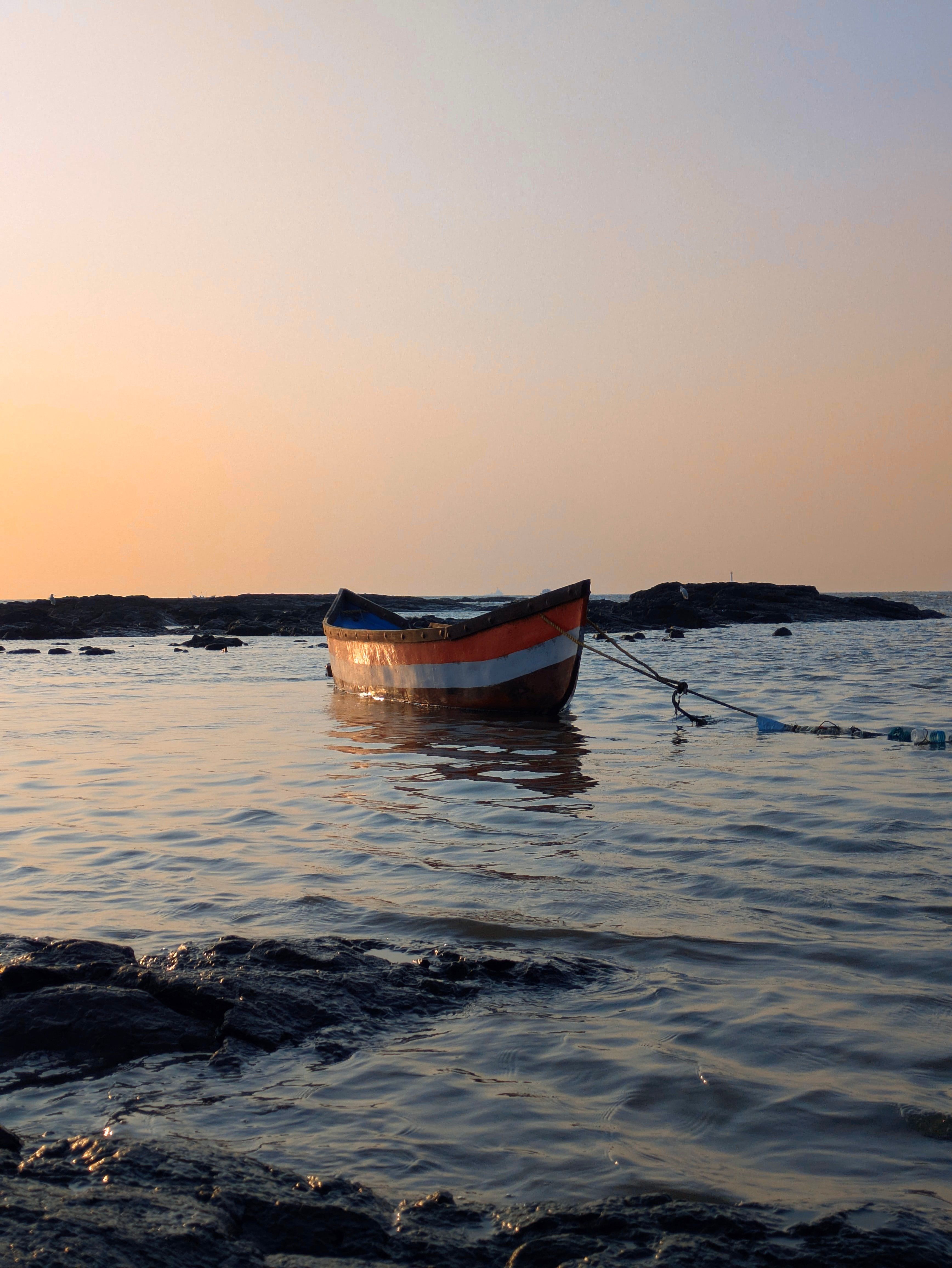Tranquil Boat at Sea during Sunset · Free Stock Photo