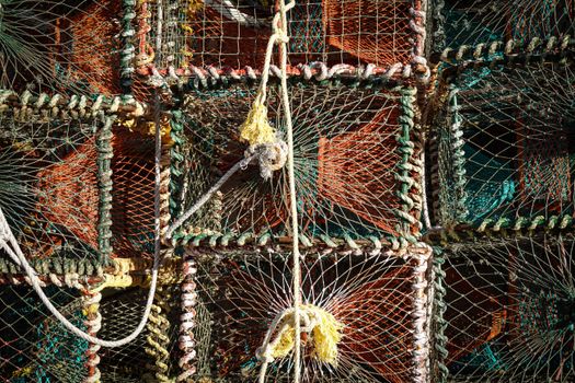 Close-up view of fishing nets and ropes, showcasing intricate patterns and vibrant colors.