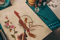 Detailed illustration of flowers and sword examined with a magnifying glass.