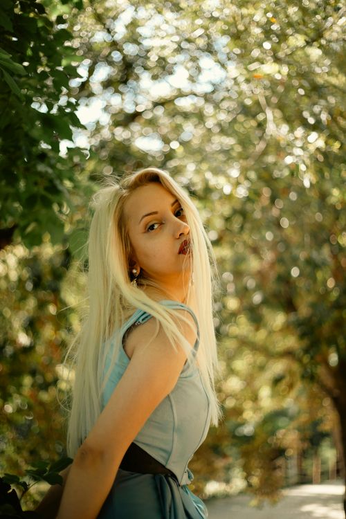 Young Woman Posing Outdoors in Natural Light · Free Stock Photo