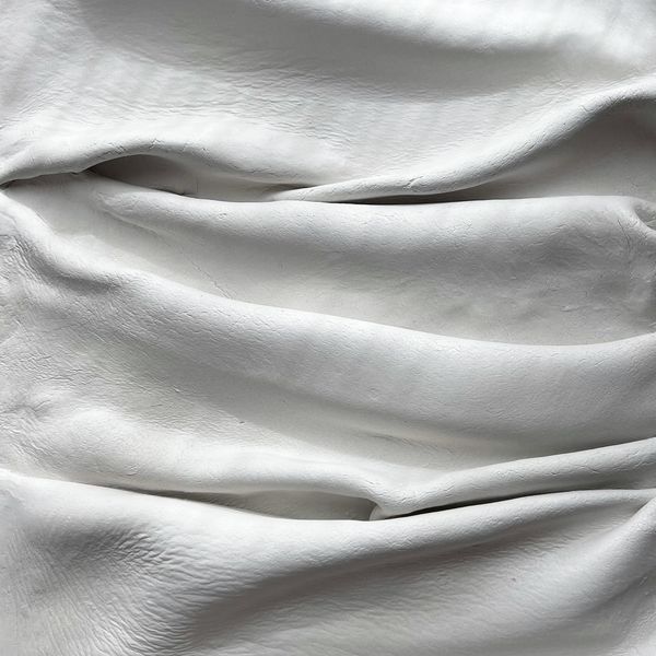 Soft white fabric folded into deep folds — Natalia S on Pexels