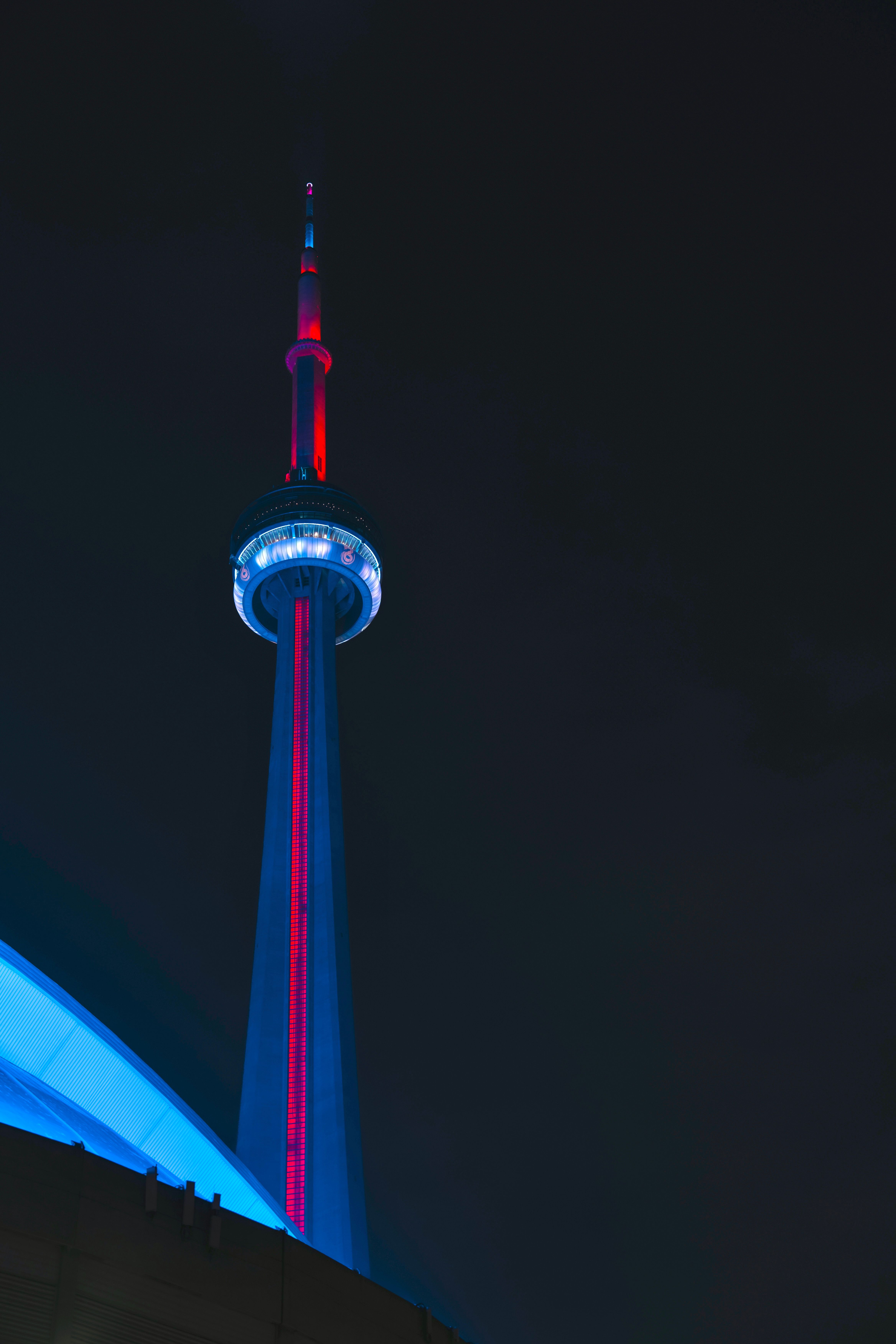 Illuminated CN Tower in Toronto Night Skyline · Free Stock Photo