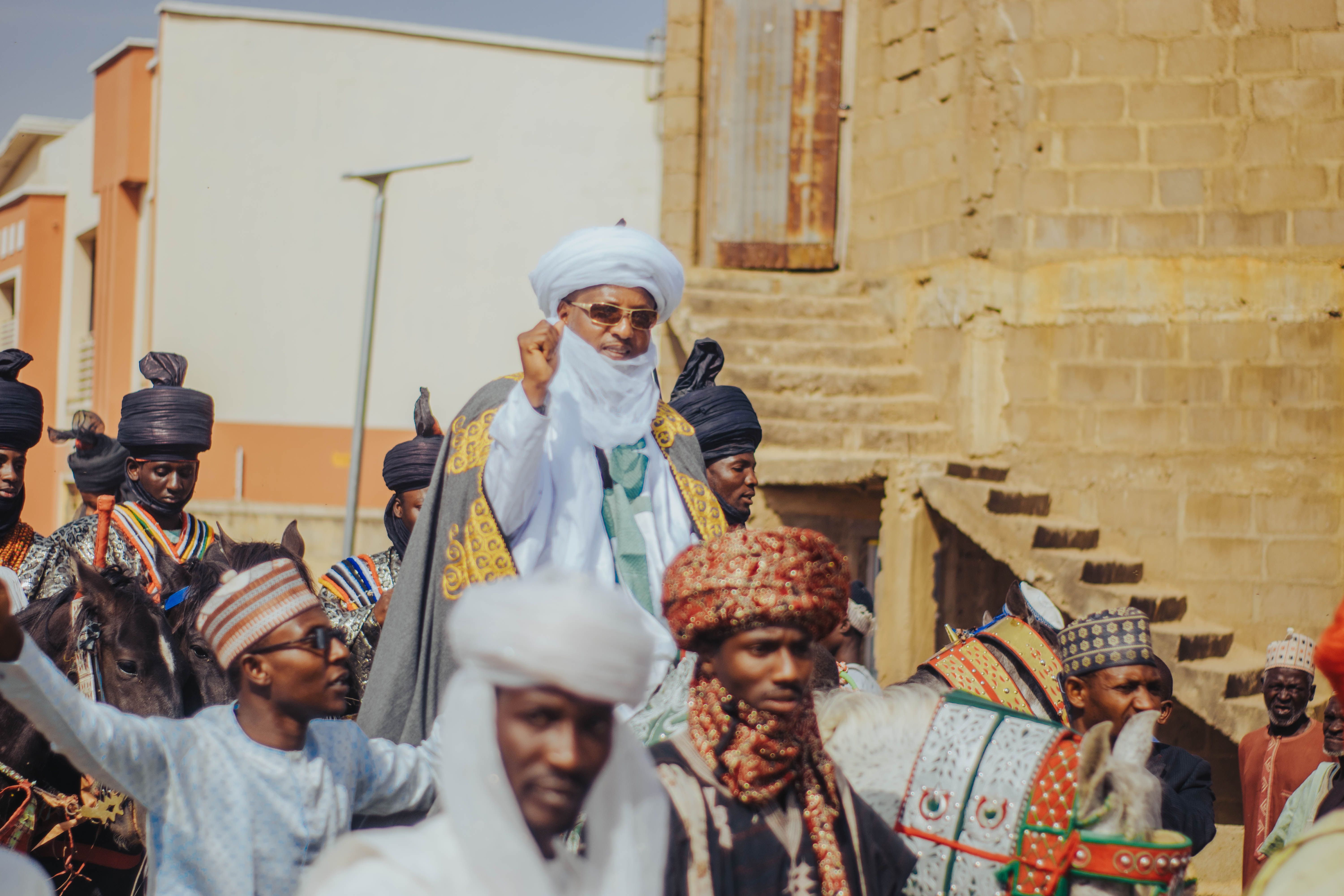 A vibrant cultural parade in Zaria City, showcasing traditional attire and festive spirit.