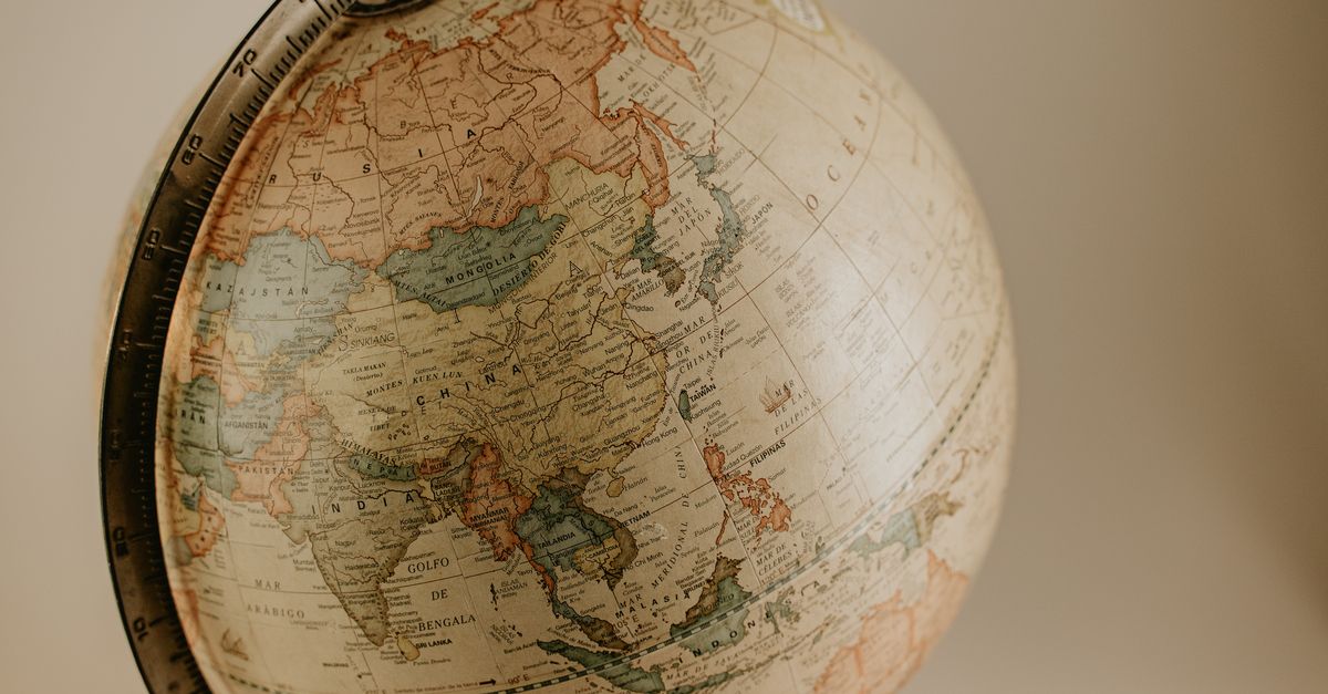 world map with red and green zones representing tech regulation regions