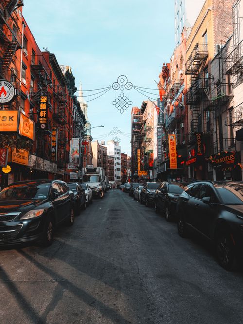 Free A bustling street in Chinatown showcasing colorful buildings and signs. Stock Photo