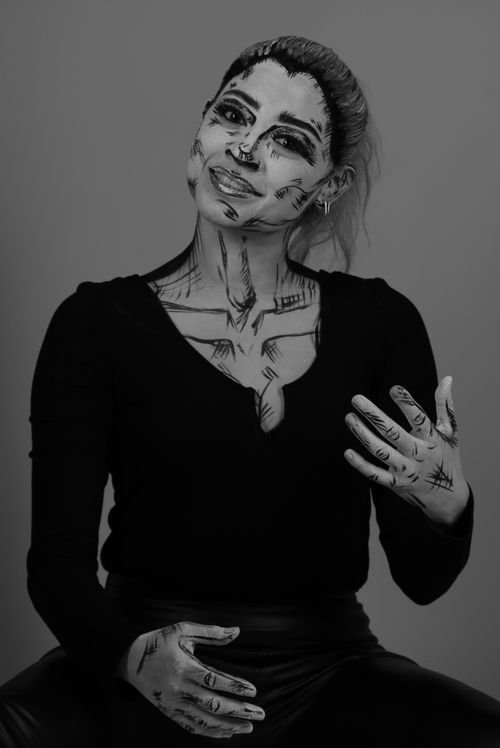 Free Artistic black and white portrait with pop art inspired makeup in a studio setting. Stock Photo