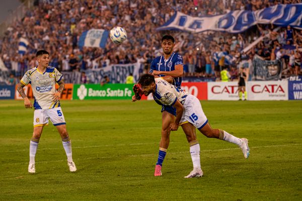 Intense soccer match action with players competing for the ball