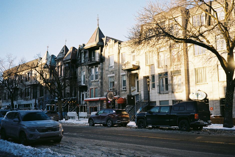 Quaint urban street scene with historic buildings in winter afternoon.