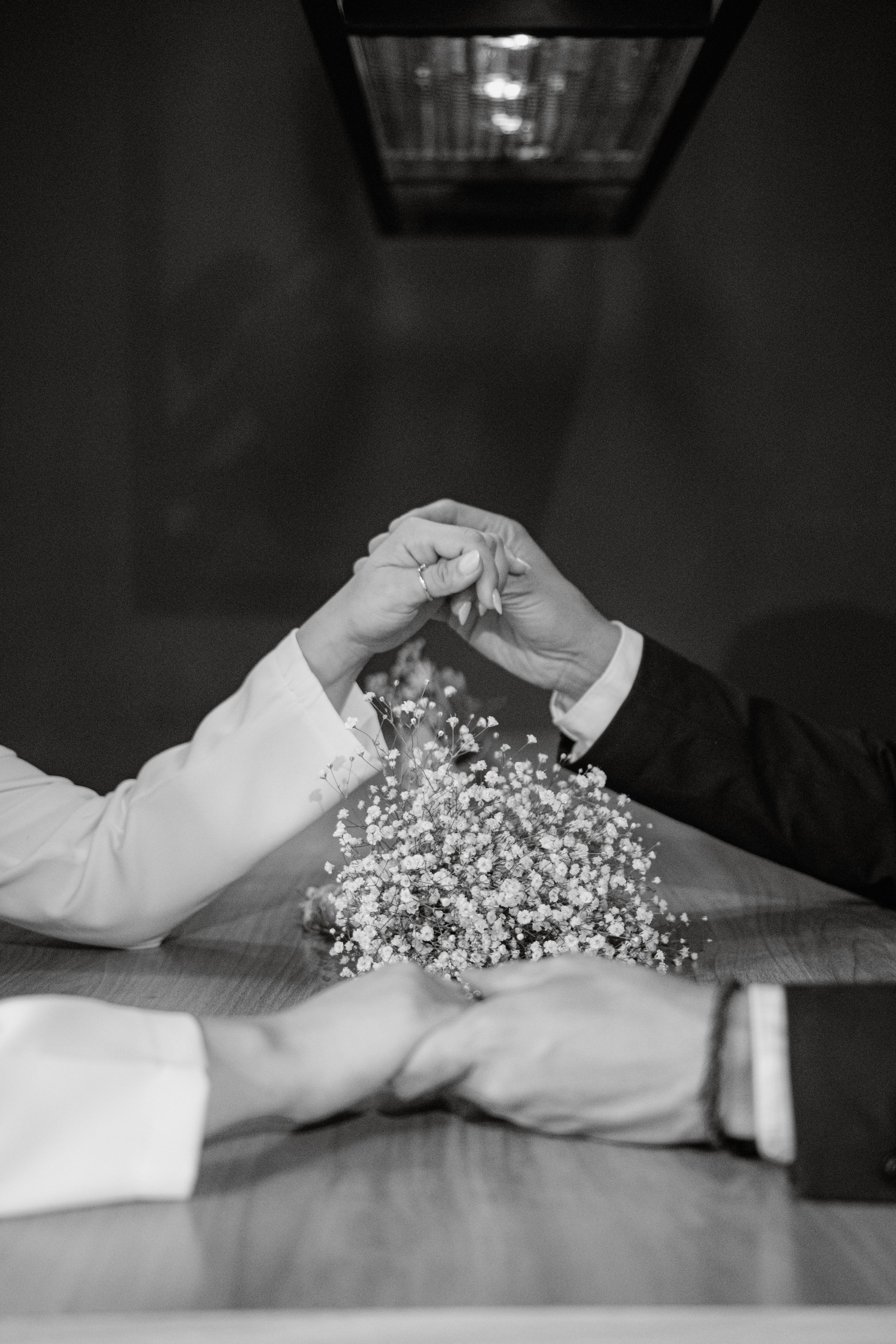 Romantic Couple Holding Hands in Black and White · Free Stock Photo