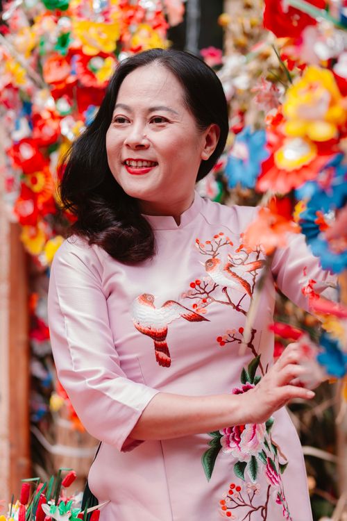 Woman in Traditional Dress Amidst Colorful Flowers · Free Stock Photo