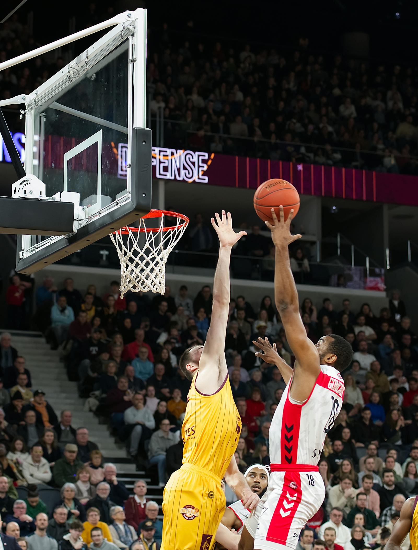 Basketball players competing during an intense game