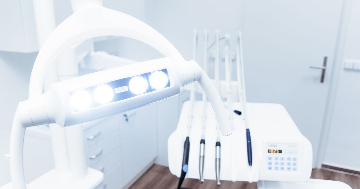 Bright modern dental clinic room with equipment