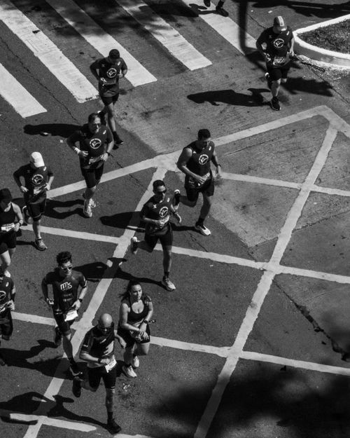 Free Black and white aerial shot of runners in a Sao Paulo marathon on city streets. Stock Photo