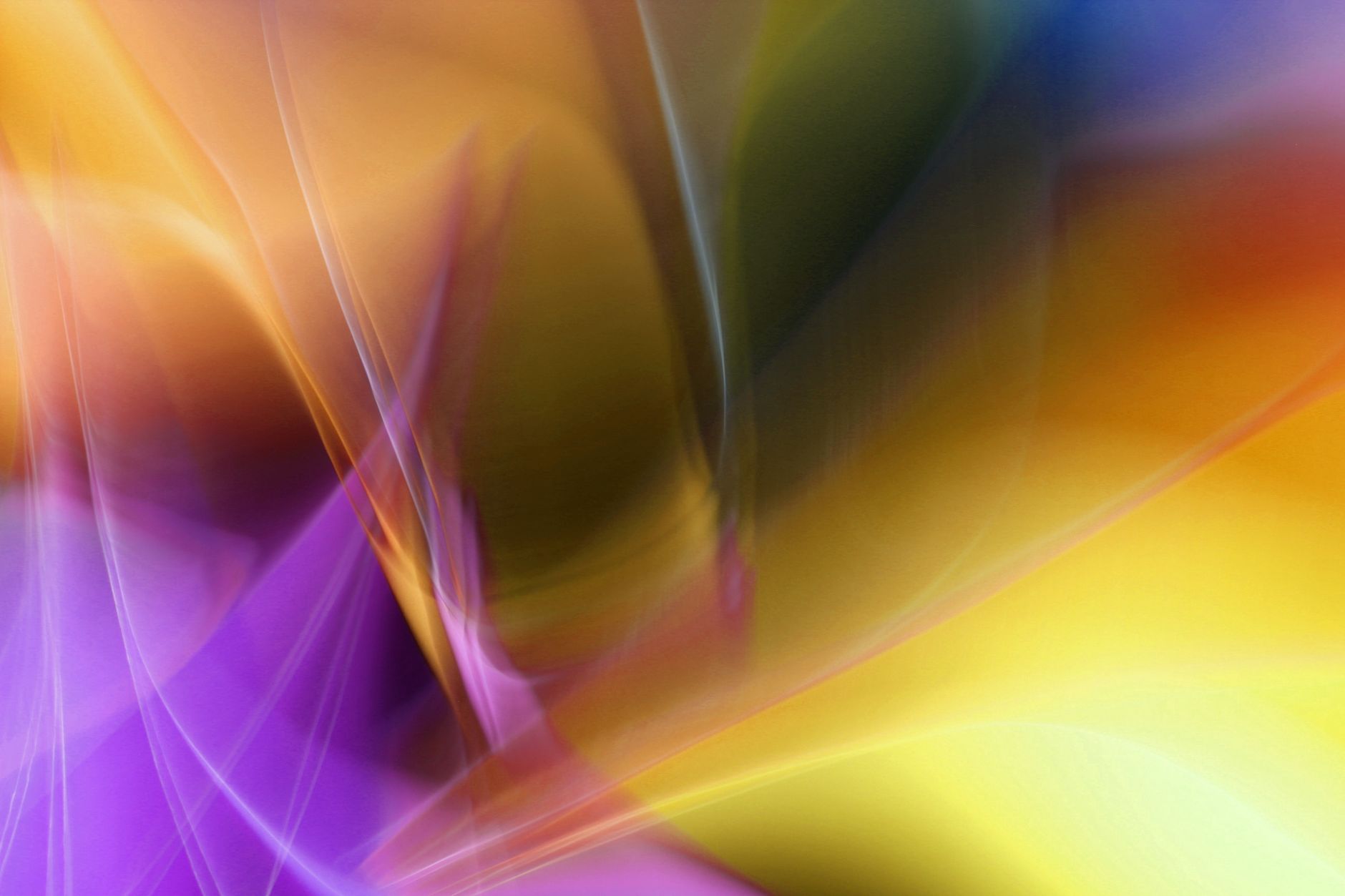 Colorful abstract art with swirling light patterns, featuring a blend of purple, yellow, and orange hues.