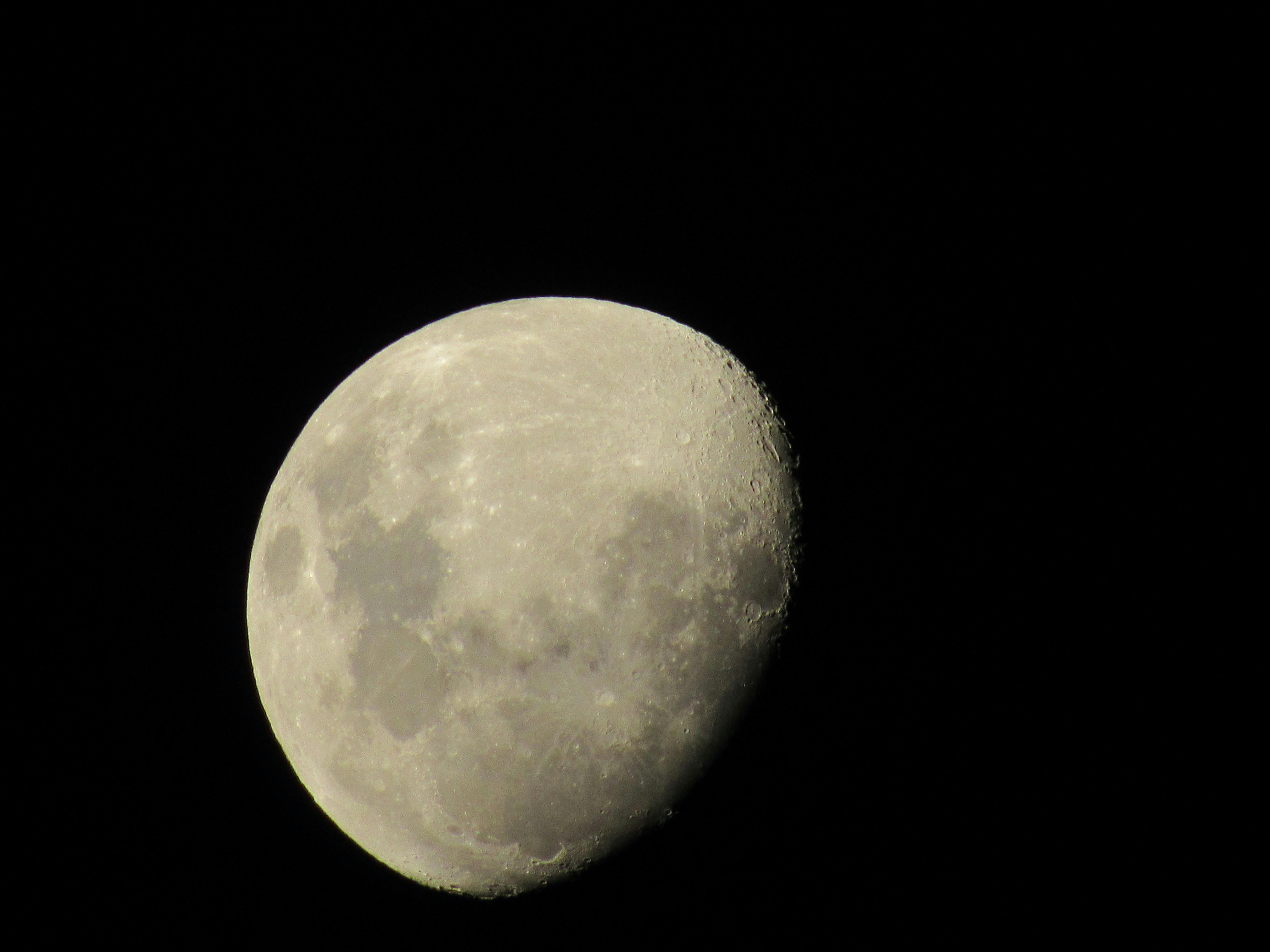 PCSO Lotto ticket overlaid with a glowing moon phase calendar, suggesting a connection between lunar cycles and lottery number selection.