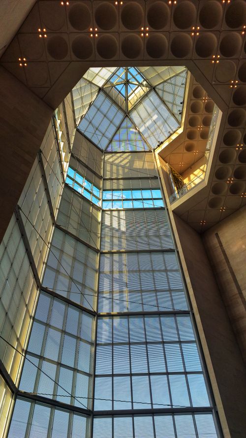 Free Look up at the stunning geometric glass ceiling of a modern building in Doha, Qatar. Stock Photo