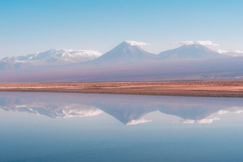 Free Serene landscape of Andes Mountains reflecting in a tranquil lake in Antofagasta, Chile. Stock Photo