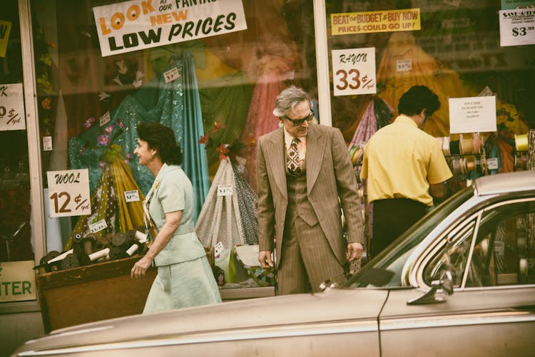 Man Looking At A Vintage Car