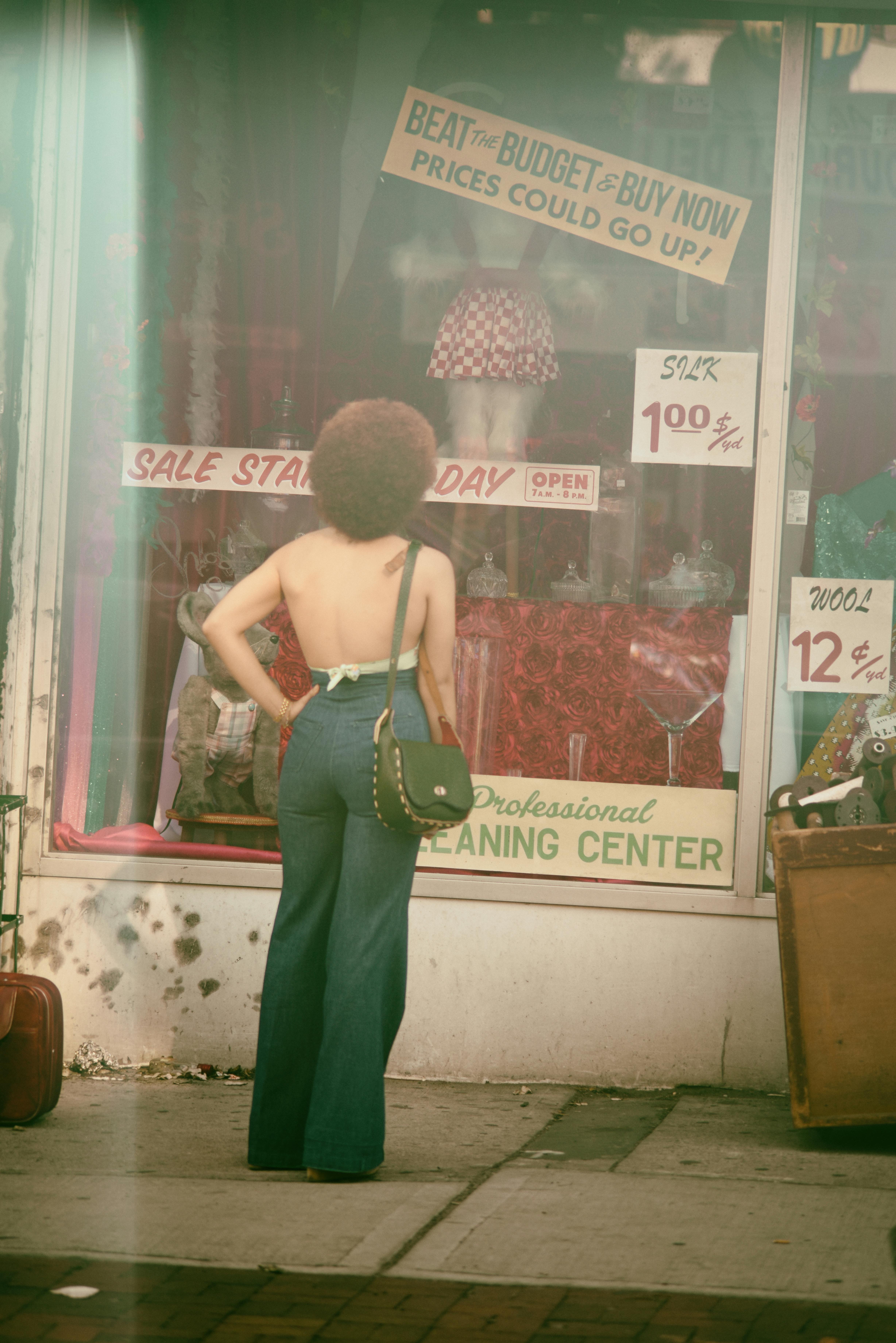 person standing infront of a display window