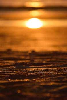 A mesmerizing sunset over Matosinhos beach with golden sands and a serene ocean view.