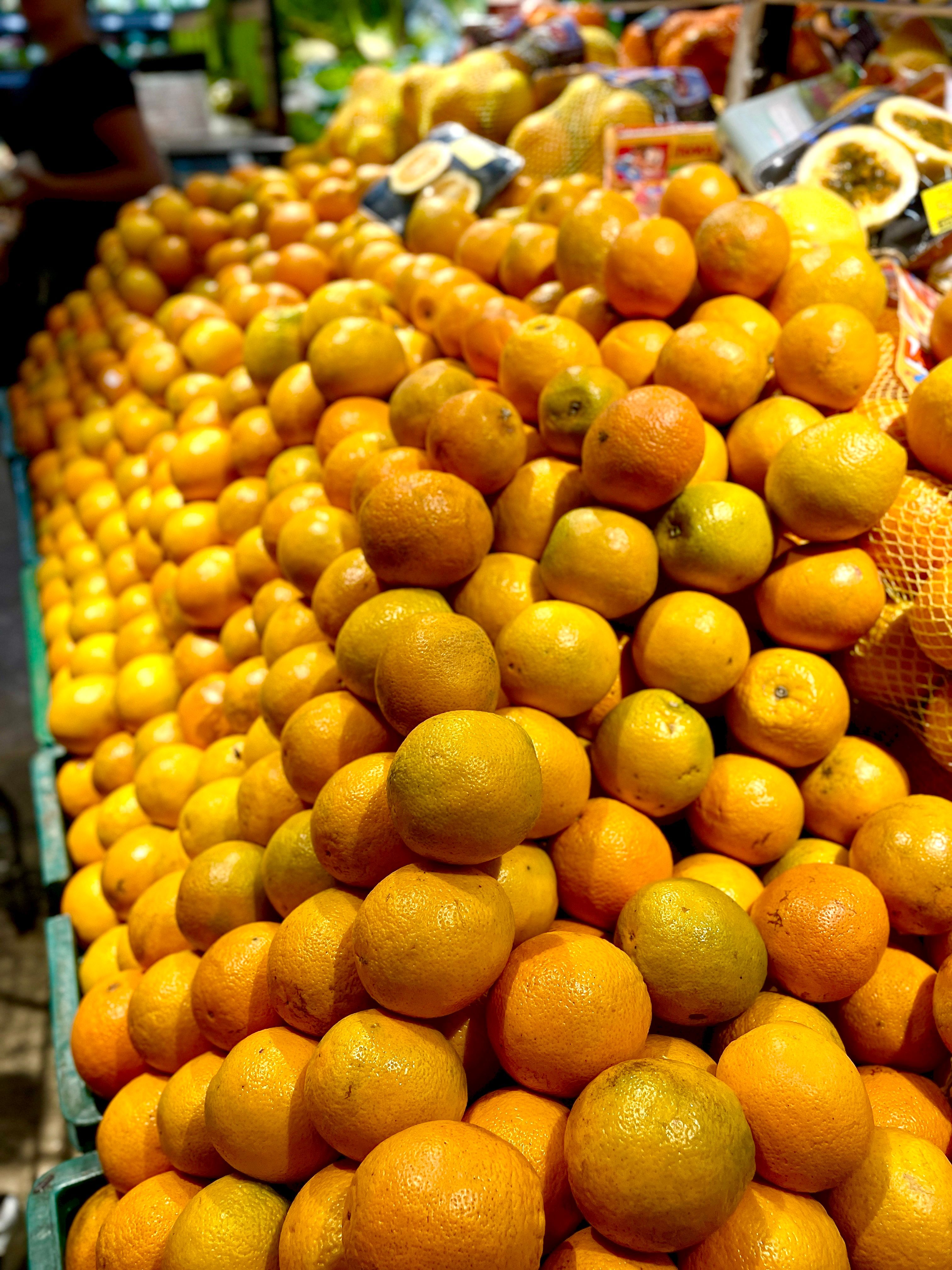Vibrant Stack of Fresh Oranges in Market · Free Stock Photo