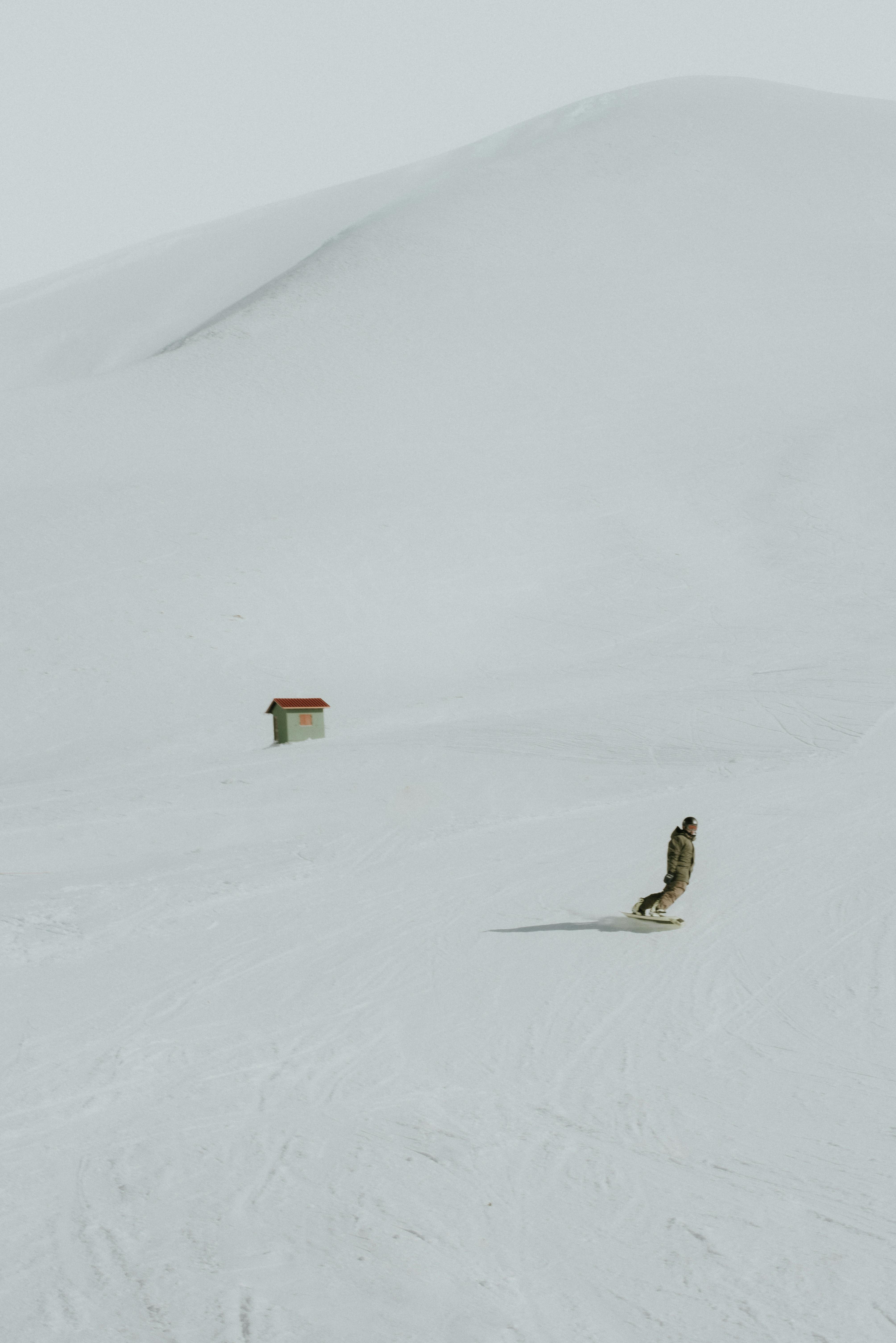 solo snowboarder on pristine greek slope