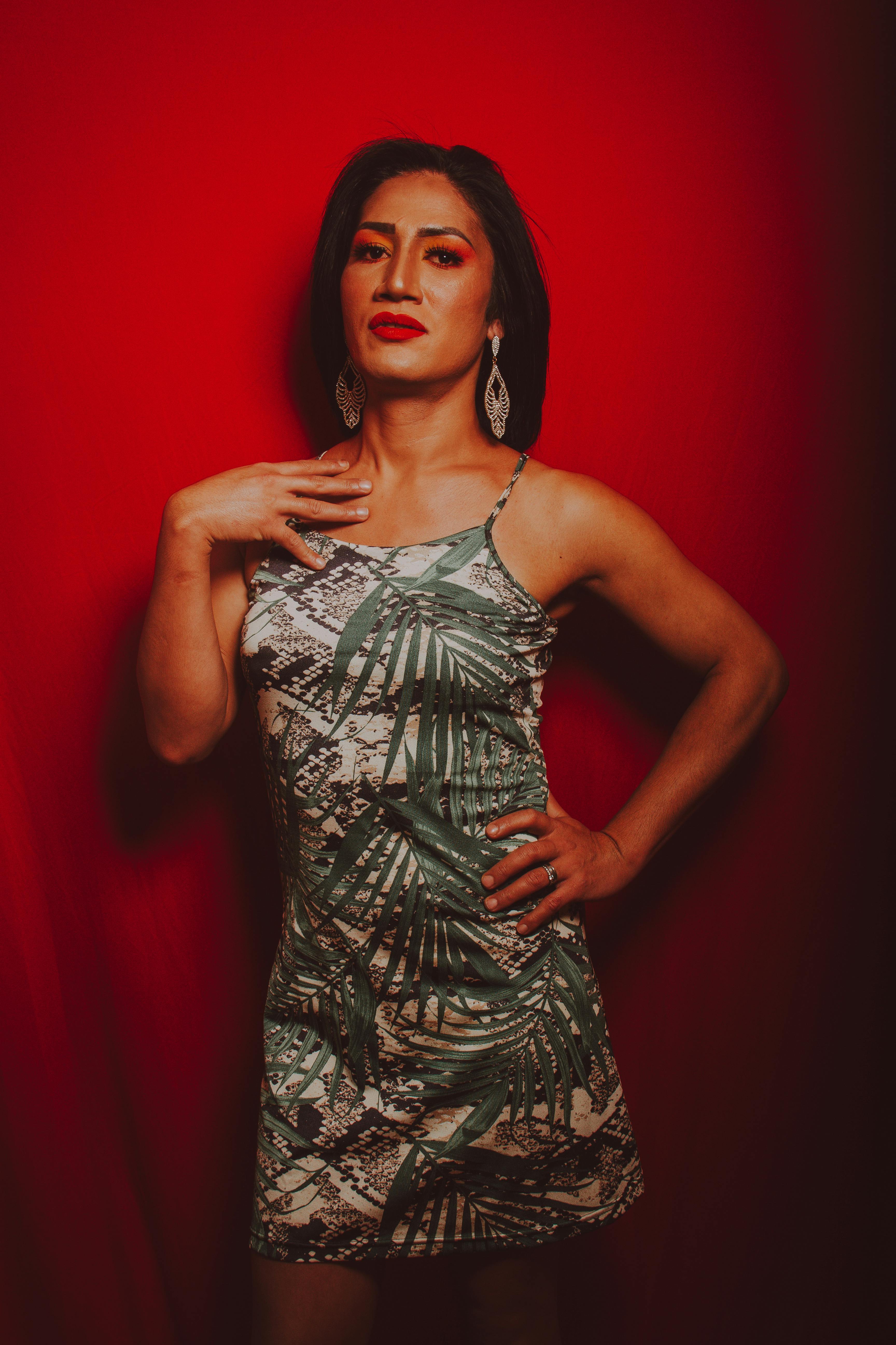 Fashionable Woman in Tropical Pattern Dress · Free Stock Photo