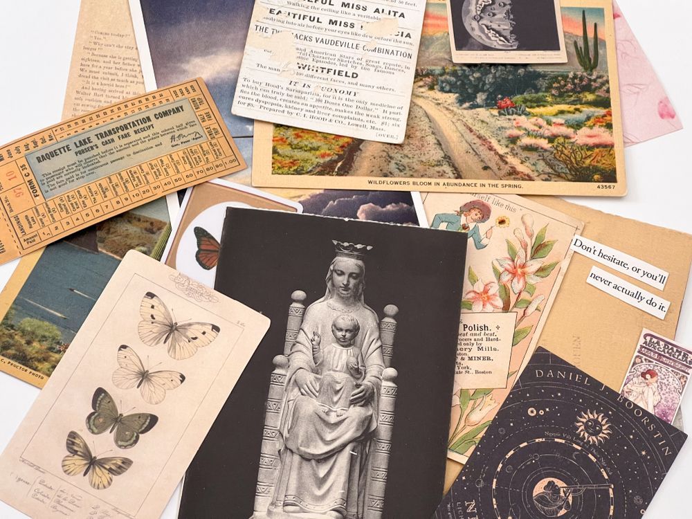 flat lay of vintage ephemera and postcards with art and nature