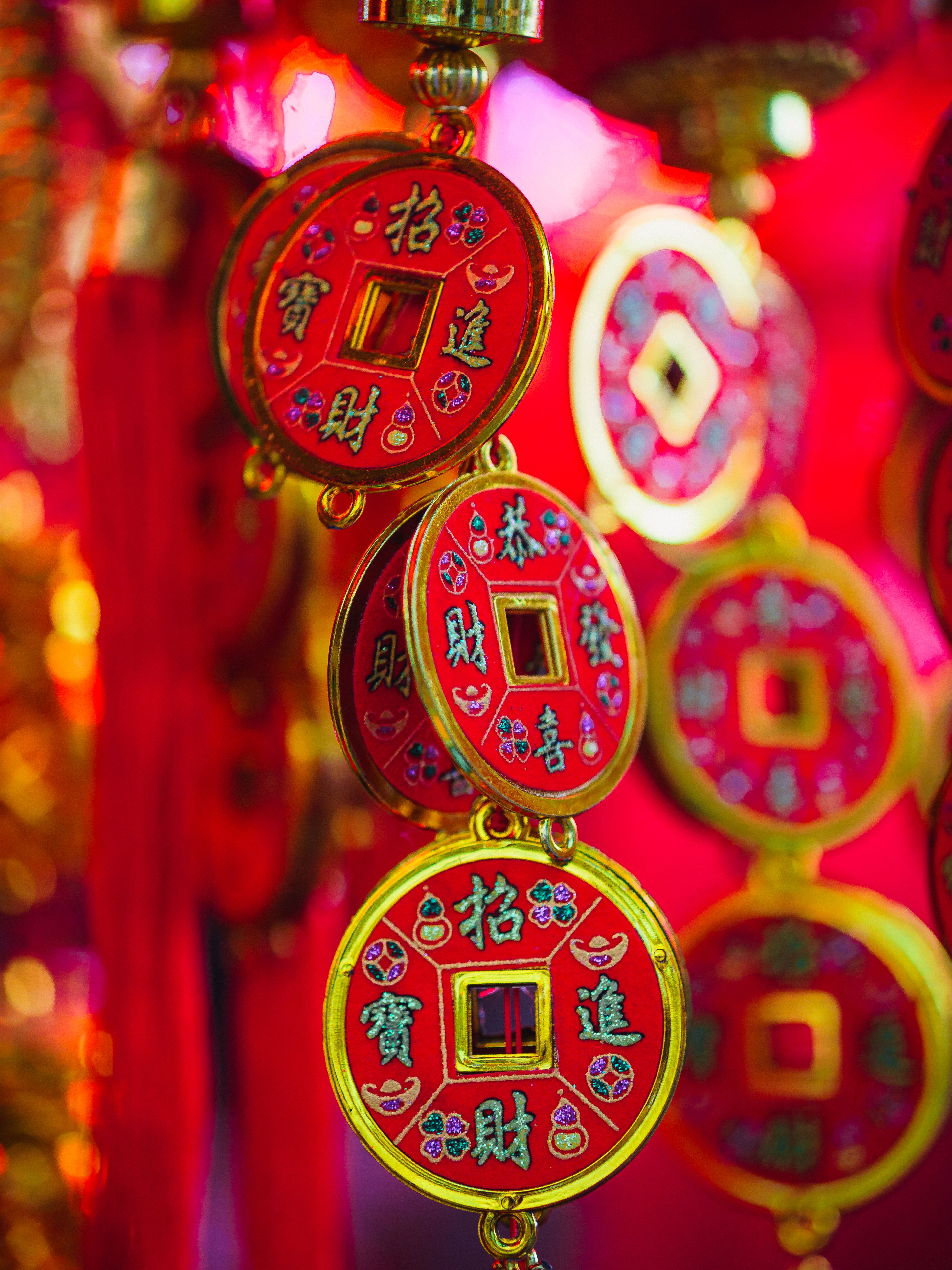 Vibrant Chinese New Year coins symbolize prosperity and good fortune.