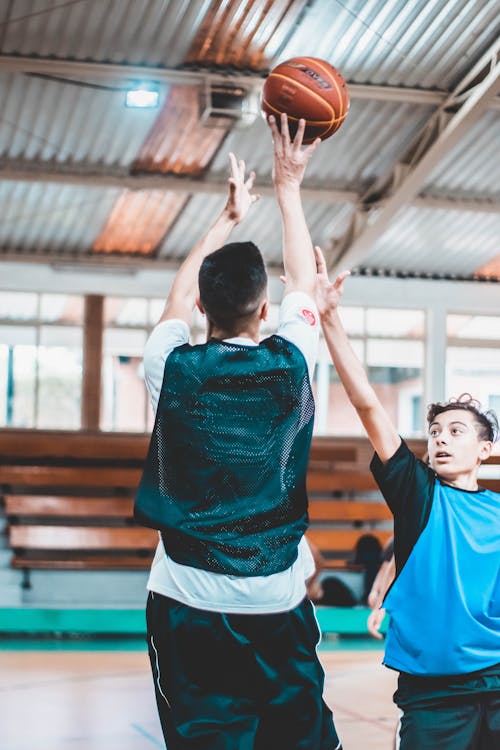 Photo Of Men Playing Basketball