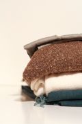 Folded wool sweater — photo by Kate L on Pexels