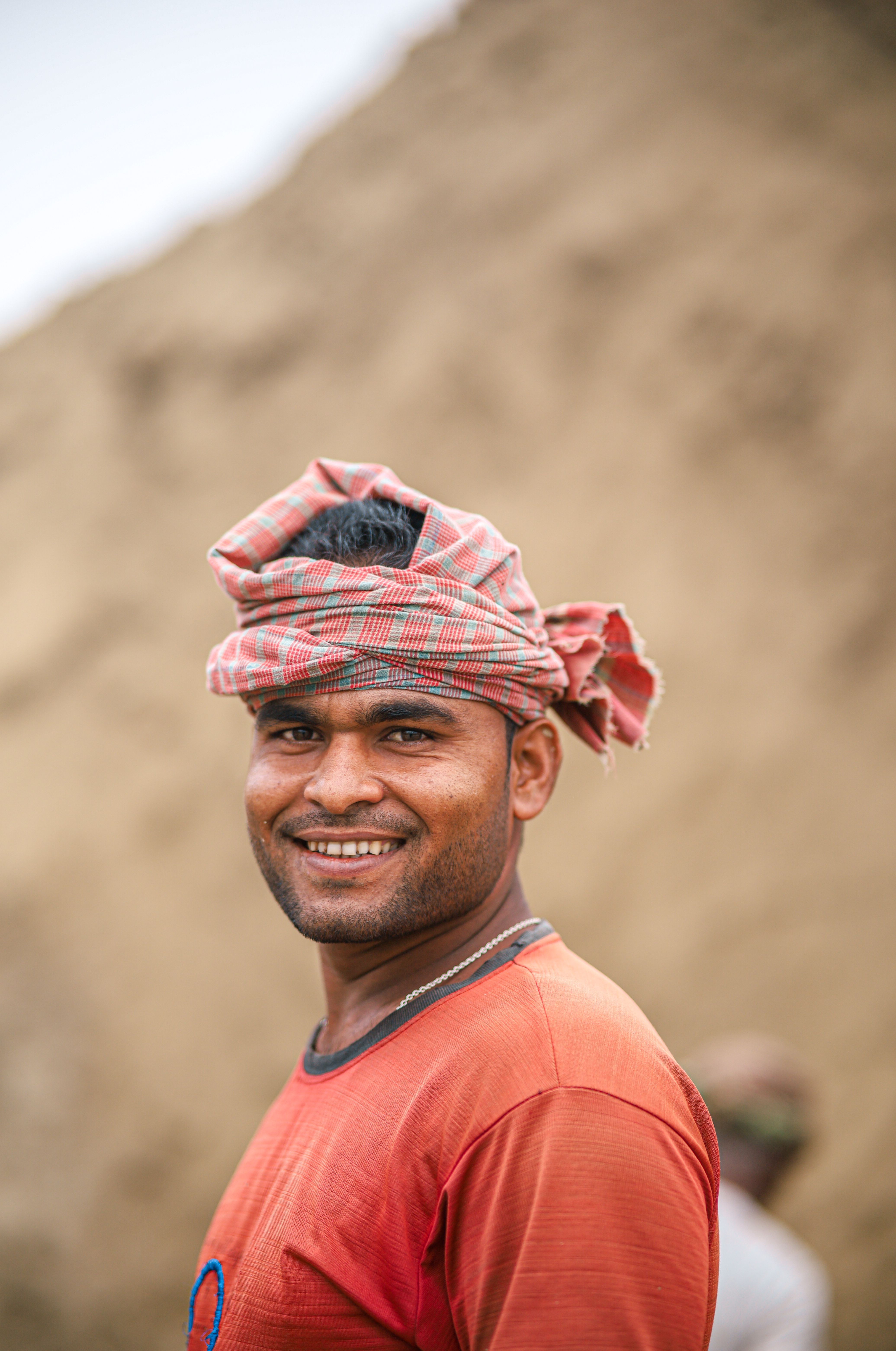 Smiling Man Wearing a Turban Outdoors · Free Stock Photo