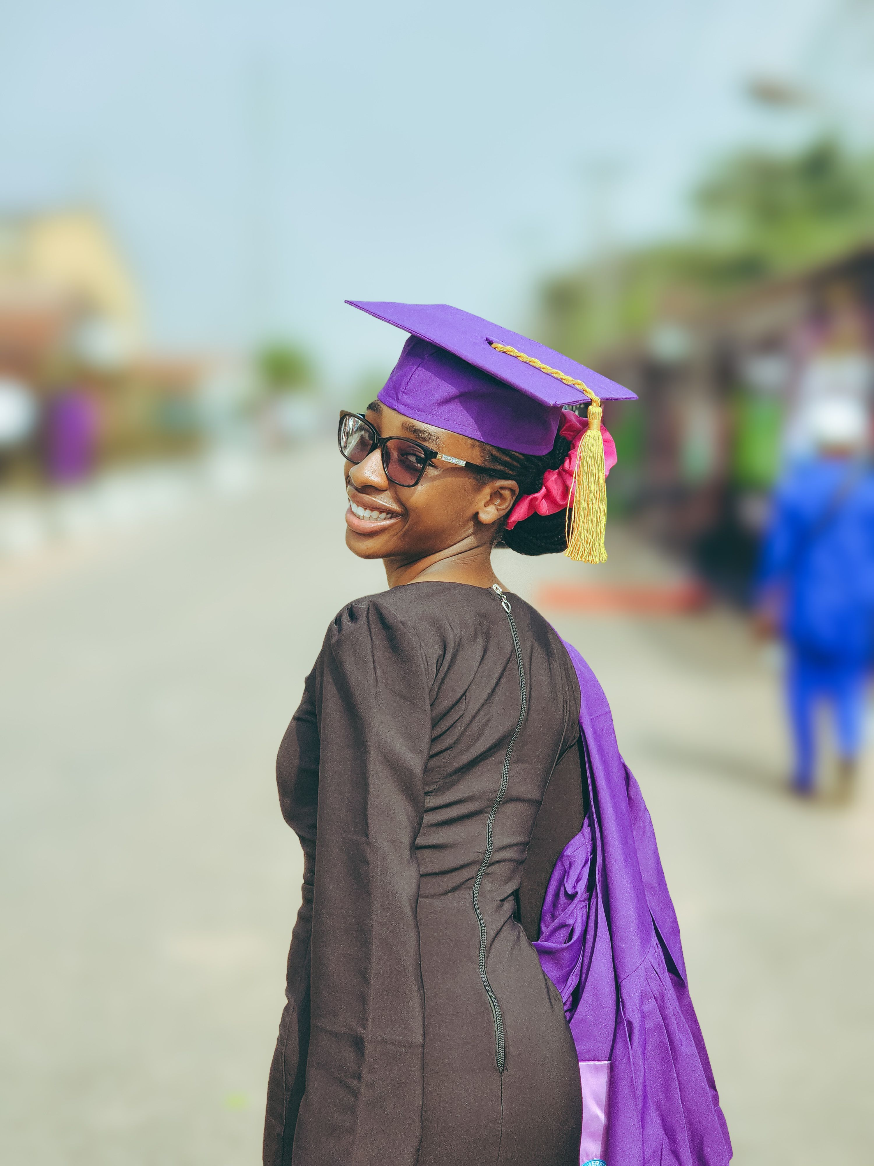 Cheerful Graduate Celebrating Achievement Outdoors · Free Stock Photo