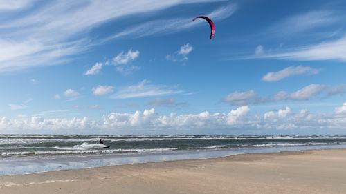 Free A thrilling kitesurfing experience on the serene shores of Henne Beach, Denmark. Stock Photo