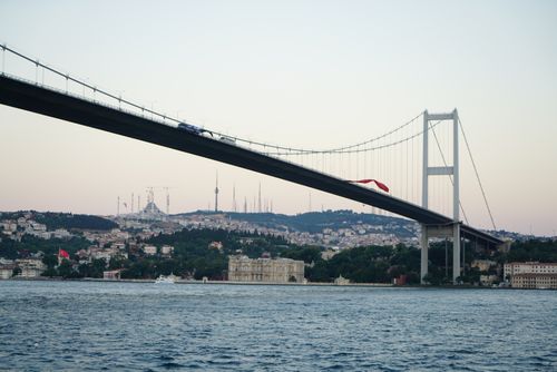 Free A scenic view of the Bosphorus Bridge in Istanbul, Turkey, with the city skyline at dusk. Stock Photo