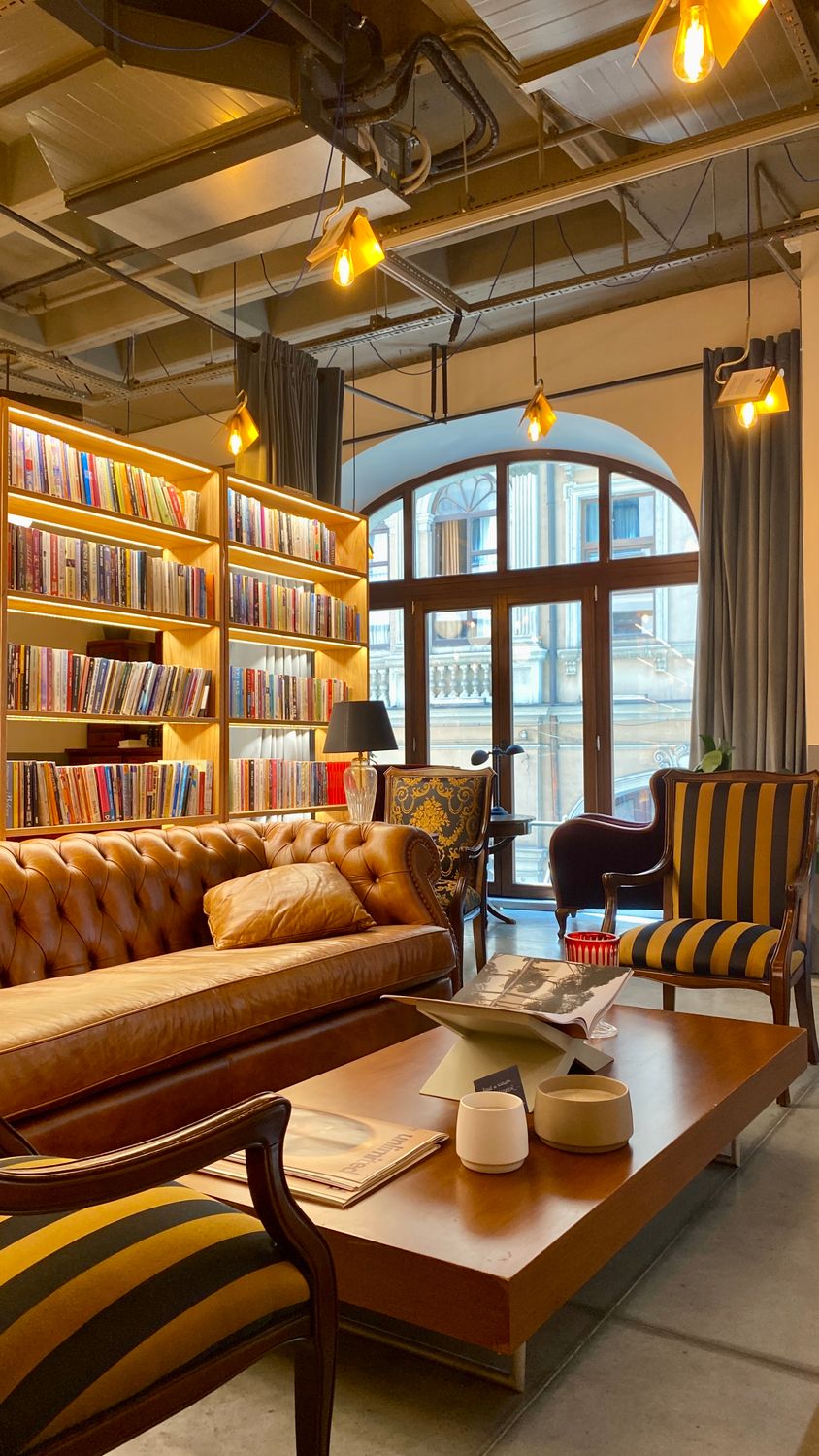 Cozy Bookstore Interior with Leather Sofa and Bookshelves · Free Stock ...