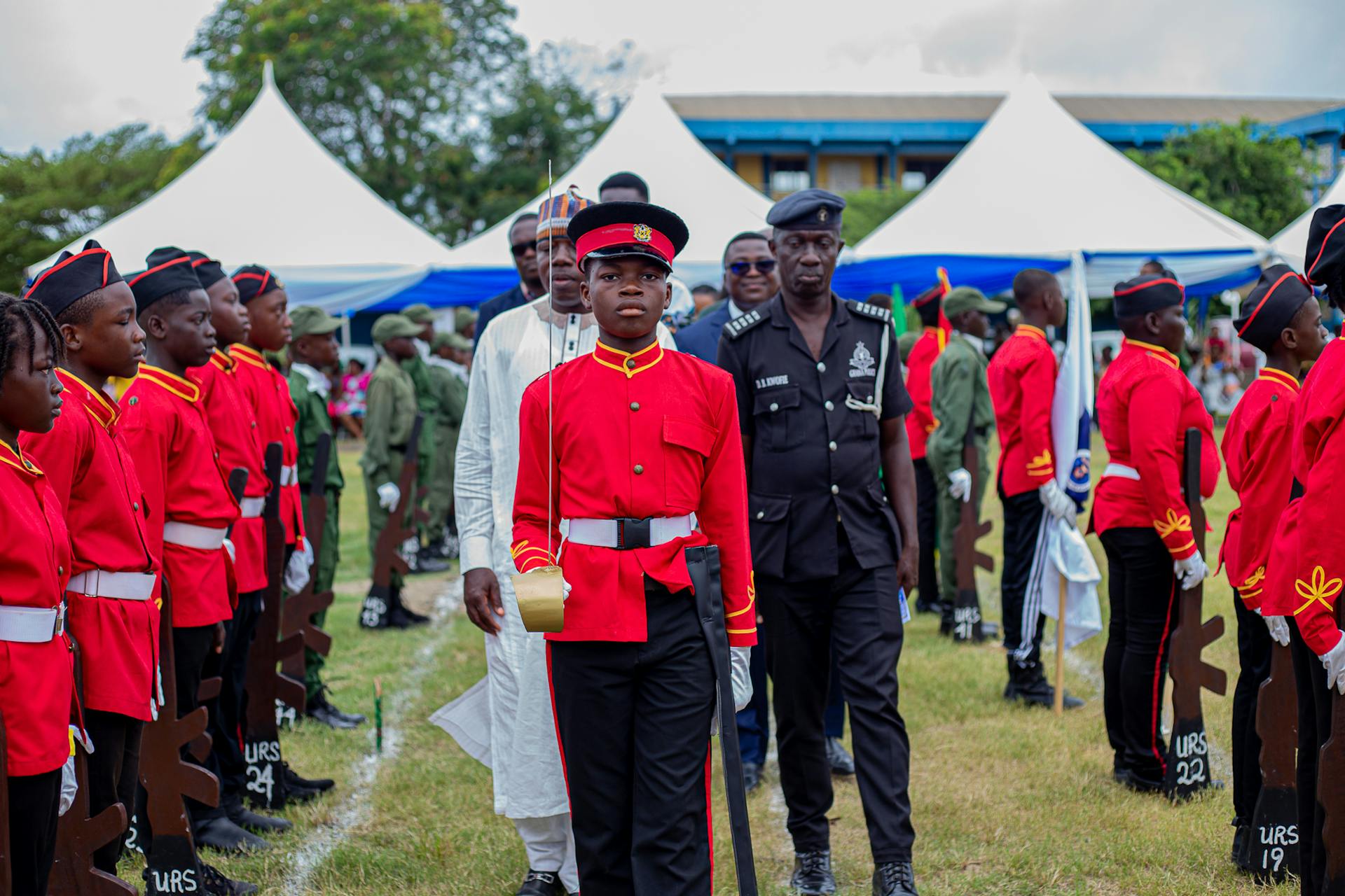 Students in uniform at a cadet parade in Winneba, Ghana, showcasing discipline and unity.