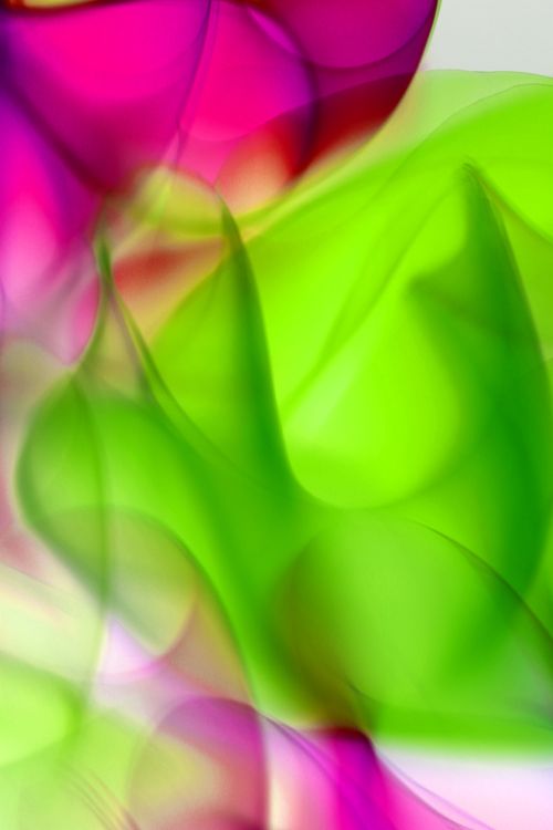 Free Vibrant abstract art with flowing green and pink light smoke textures. Stock Photo