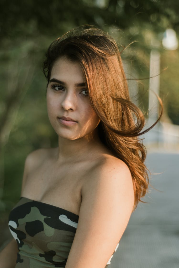 Photo Of Woman Wearing Camouflage Top