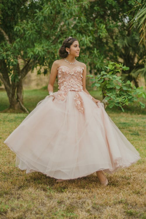 Photo Of Woman Wearing Pink Gown