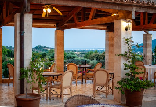 Empty outdoor restaurant terrace in Mallorca with stunning countryside view.