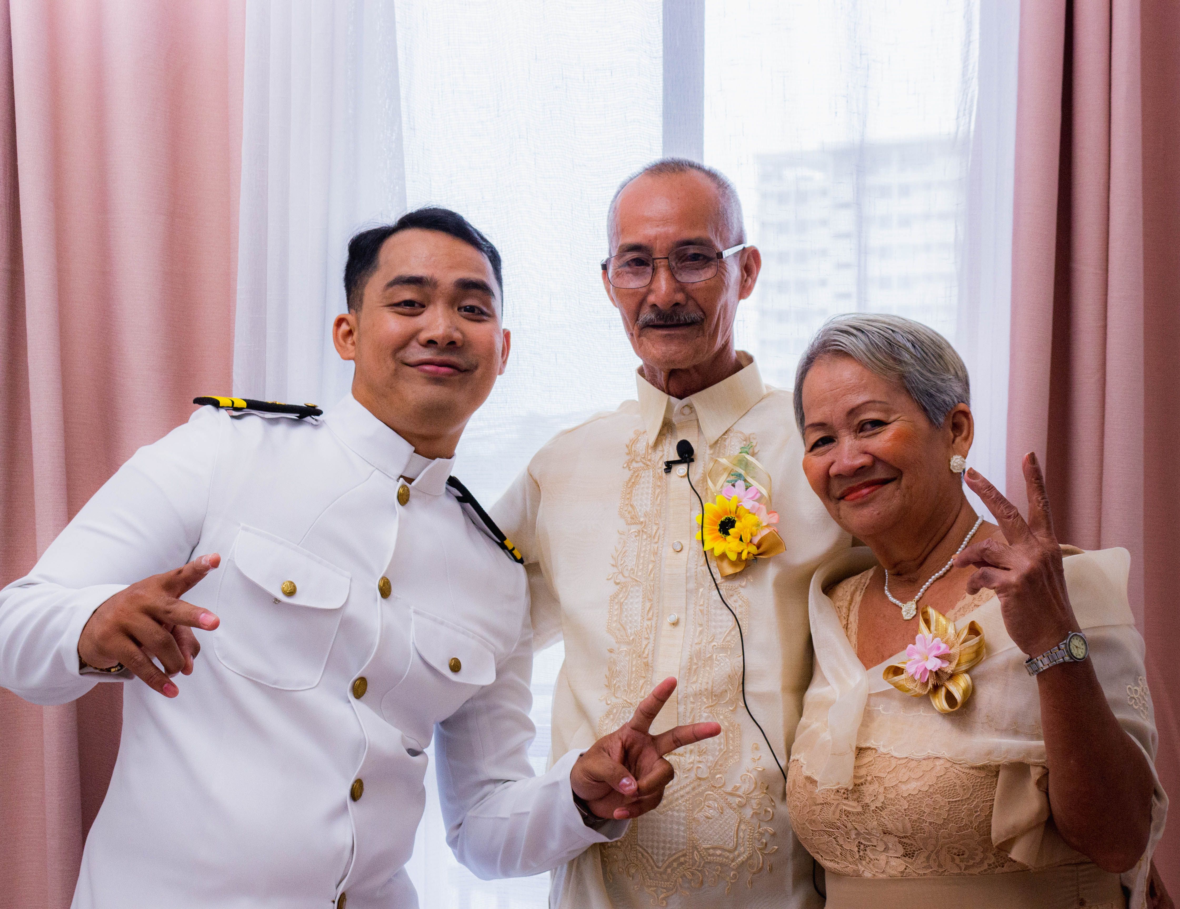 A man proudly wearing a custom-made Barong Tagalog, the national attire of the Philippines