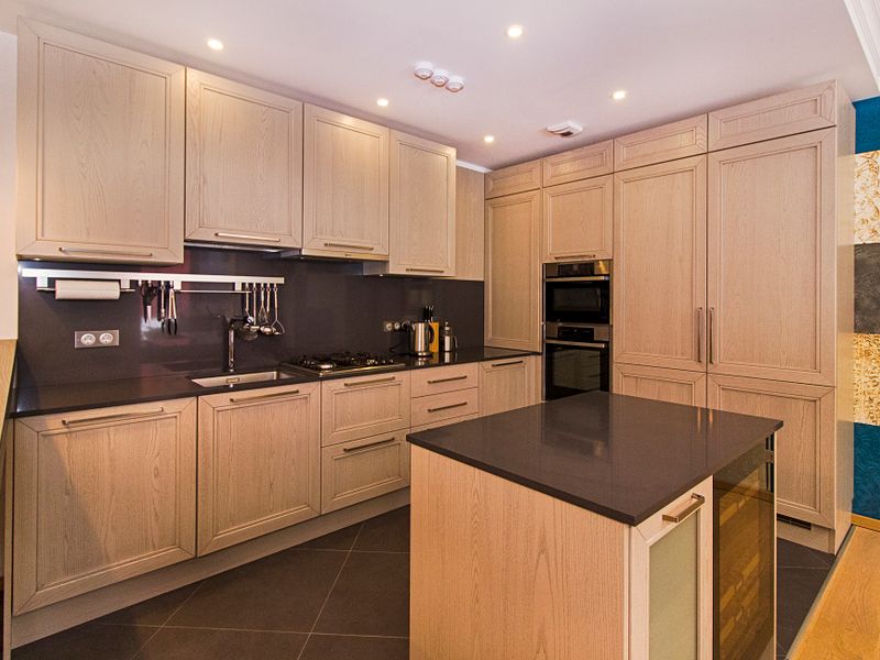 Maytag appliance that needs same-day repair Contemporary kitchen with wooden cabinetry and a sleek island