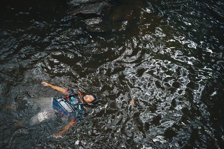 High-Angle Photo Of Man Floating On Water