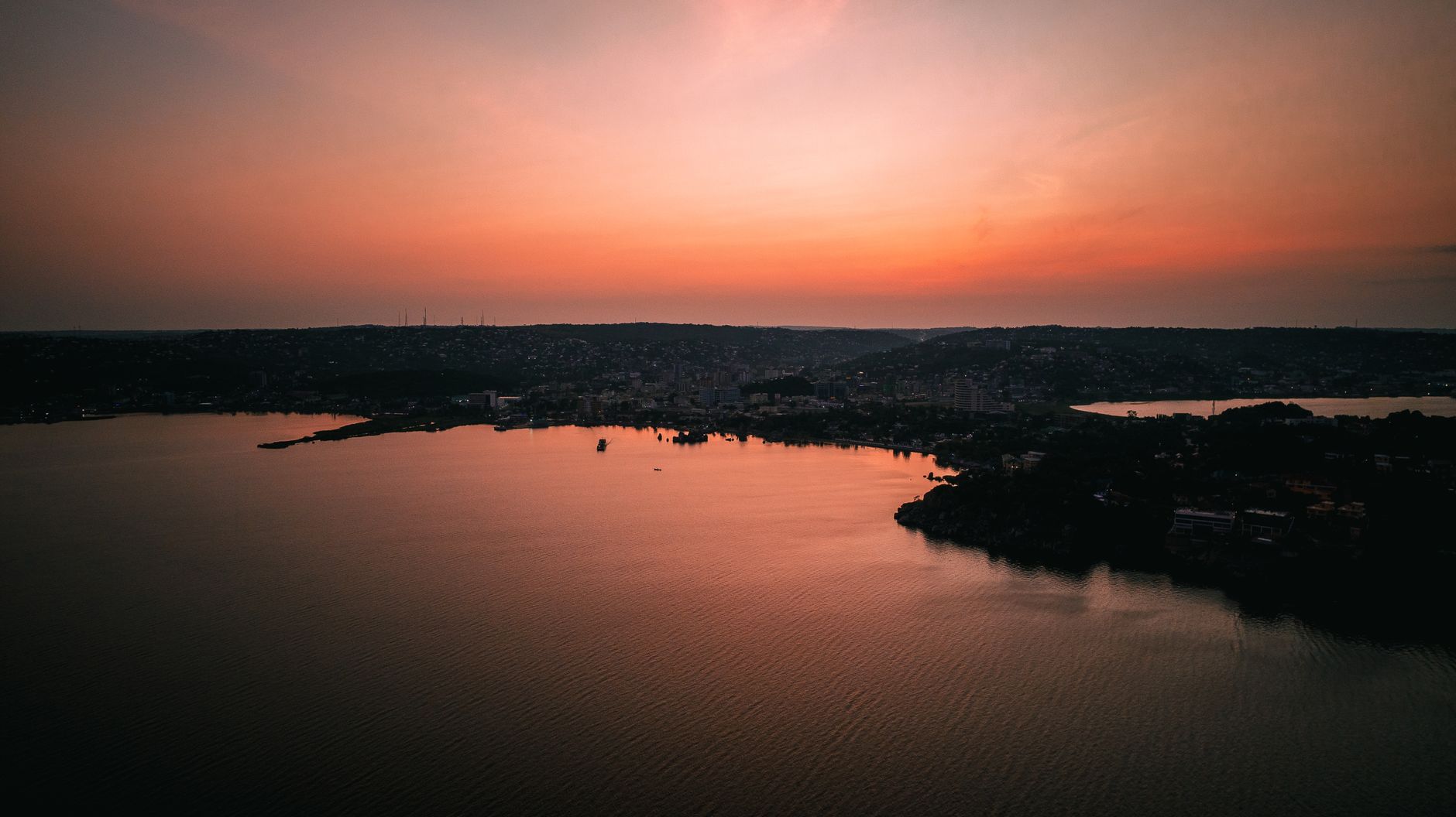 A breathtaking sunset over Lake Victoria in Mwanza, Tanzania, showcasing tranquil waters and vibrant skies.