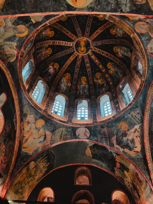 Free Stunning Byzantine church dome featuring intricate religious murals and arches. Stock Photo
