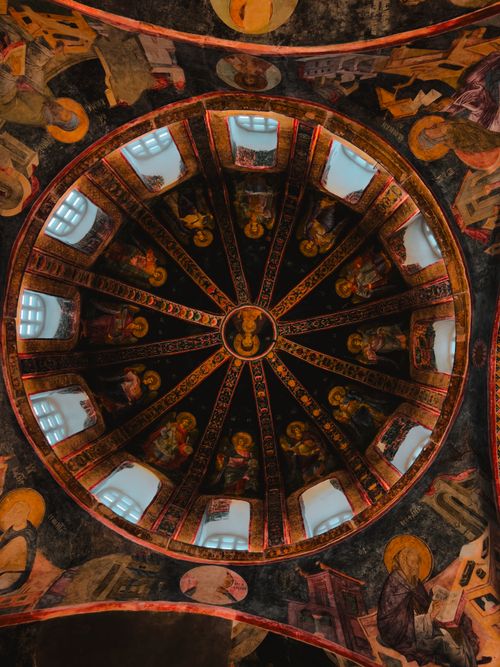 Free Captivating view of intricate frescoes in the dome of an ancient church, showcasing vibrant religious artistry. Stock Photo