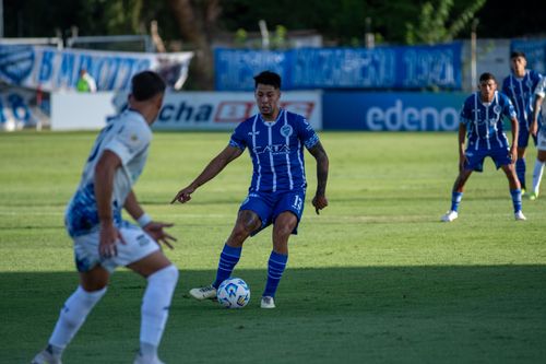 Free Soccer players in action on a sunny sports field during an intense match. Stock Photo