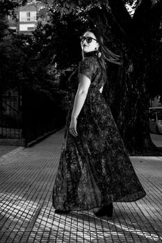 Stylish woman captured in black and white on the streets of Buenos Aires.